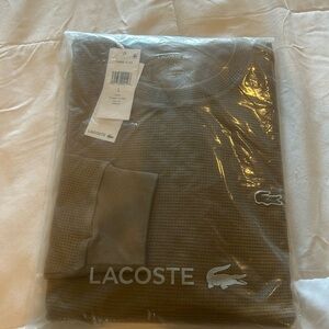 Lacoste Shirt, size large, never been worn, tan